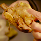 hand holding pork chop sandwich